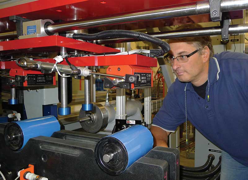 Man Inspecting Conveyor Belt Systems